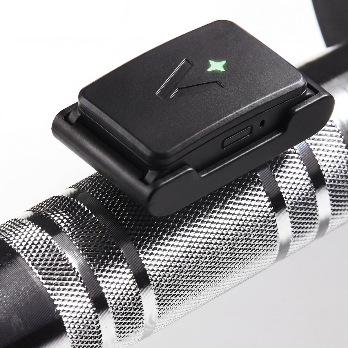 Velocity sensor clipped to the barbell